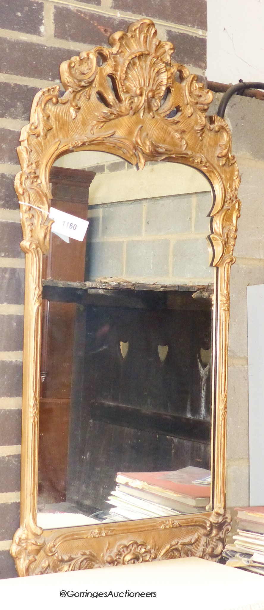 A 18th century gilt wood style wall mirror. W-46, H-100cm.